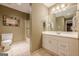 Well-lit bathroom featuring a vanity, mirror, and a shower, providing a clean and functional space at 7415 Northampton Ct, Cumming, GA 30040