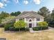 Attractive two-story home with manicured lawn, mature trees, and a welcoming facade at 7415 Northampton Ct, Cumming, GA 30040