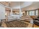 Spacious living area connects to kitchen with neutral color palette and an open floorplan at 7415 Northampton Ct, Cumming, GA 30040