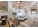Bright living room boasts soaring ceilings, a fireplace, and elegant furnishings at 7415 Northampton Ct, Cumming, GA 30040