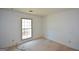 Bedroom with carpet, white walls, and a window at 154 Waverly Way, Alpharetta, GA 30009