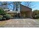 This property boasts a covered carport, mature landscaping and an ADT security system at 154 Waverly Way, Alpharetta, GA 30009