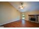 Inviting living room with vaulted ceilings, stone fireplace, fan and hardwood floors at 154 Waverly Way, Alpharetta, GA 30009