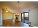 Open living room with hardwood floors, vaulted ceiling, fireplace, and sliding doors at 154 Waverly Way, Alpharetta, GA 30009