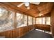 Screened sunroom with wood panels and ceiling fans at 154 Waverly Way, Alpharetta, GA 30009