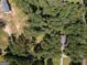 Aerial view of the property showing the home and surrounding trees, as well as other homes nearby at 204 Mitchell Rd, Fayetteville, GA 30214