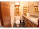 Cozy bathroom boasting a vanity, toilet, and tiled floors, and other fixtures at 204 Mitchell Rd, Fayetteville, GA 30214