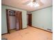 Bedroom features include a ceiling fan and a closet with louvered doors at 204 Mitchell Rd, Fayetteville, GA 30214