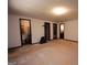 Spacious bedroom featuring crown molding, closet, and multiple doorways at 204 Mitchell Rd, Fayetteville, GA 30214