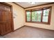 Breakfast nook with large bay window, tile floor, and wooded view at 204 Mitchell Rd, Fayetteville, GA 30214