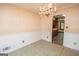 Formal dining area featuring chandelier, wainscoting, and hardwood floors at 204 Mitchell Rd, Fayetteville, GA 30214