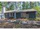 Exterior view showing the side of the home and the wooden path leading to the backyard at 204 Mitchell Rd, Fayetteville, GA 30214