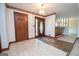 Inviting foyer with tile flooring, dark wood trim, and a view into the spacious living areas at 204 Mitchell Rd, Fayetteville, GA 30214