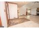 Bright foyer with tile flooring and dark wood accents that leads to the open living spaces at 204 Mitchell Rd, Fayetteville, GA 30214