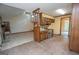Open kitchen area with tiled floors, wood cabinets, and modern appliances at 204 Mitchell Rd, Fayetteville, GA 30214