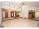 Open-concept living room featuring tile floors, high ceilings, and abundant natural light at 204 Mitchell Rd, Fayetteville, GA 30214