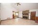 Spacious living room featuring tile floors, vaulted ceilings, and a stone fireplace at 204 Mitchell Rd, Fayetteville, GA 30214