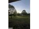 Scenic view of expansive backyard with mature trees, ideal for outdoor activities at 4529 Jersey Covington Rd, Covington, GA 30014