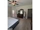 Primary bedroom featuring plush carpeting, neutral walls, and ceiling fan at 4529 Jersey Covington Rd, Covington, GA 30014