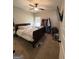 Cozy bedroom featuring a ceiling fan, natural light, and comfortable carpet flooring at 4529 Jersey Covington Rd, Covington, GA 30014
