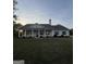 Charming single-story home with covered front porch, pillared supports, and mature landscaping at 4529 Jersey Covington Rd, Covington, GA 30014