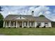 Charming single-Gathering home with a columned front porch and manicured lawn at 4529 Jersey Covington Rd, Covington, GA 30014