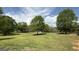 Expansive lot with lush green grass and mature shade trees, offering serene views at 4529 Jersey Covington Rd, Covington, GA 30014