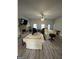 Cozy living room features a brick fireplace, ceiling fan, and ample seating at 4529 Jersey Covington Rd, Covington, GA 30014