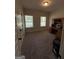 Office space with windows for light, neutral paint, and built-in wooden desk at 4529 Jersey Covington Rd, Covington, GA 30014