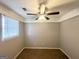 Cozy bedroom with soft carpet and a ceiling fan provides comfortable living space at 3729 Glenwood Rd, Decatur, GA 30032
