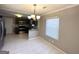 Bright dining area with tile flooring and modern chandelier, perfect for entertaining guests at 3729 Glenwood Rd, Decatur, GA 30032