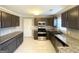 Updated kitchen features stainless steel appliances, granite countertops, and tiled backsplash at 3729 Glenwood Rd, Decatur, GA 30032