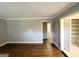 Spacious living room featuring hardwood floors, neutral paint, and ample natural light through the closet at 3729 Glenwood Rd, Decatur, GA 30032