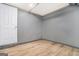 A room in the basement with tile floors, neutral colored walls, and a white door at 2695 Peeler Rd, Doraville, GA 30360