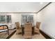 Elegant dining room featuring a round wooden table, seating for six, and hardwood floors, perfect for entertaining at 2695 Peeler Rd, Doraville, GA 30360