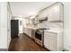 Modern kitchen with white cabinets, stainless steel appliances, and subway tile backsplash at 2695 Peeler Rd, Doraville, GA 30360