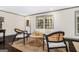 Inviting living room featuring hardwood floors, modern decor, plenty of natural light and neutral colors at 2695 Peeler Rd, Doraville, GA 30360
