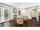 Cozy living room with a white brick fireplace, hardwood floors, and modern decor, perfect for relaxation at 2695 Peeler Rd, Doraville, GA 30360