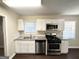 Efficient kitchen with stainless steel appliances, granite countertops, and white cabinets, perfect for modern cooking at 4250 Timber Valley Ct, Decatur, GA 30032