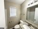 Bathroom showcases a window for natural light and granite countertops at 4992 Needle Knob Ct, Lithonia, GA 30038
