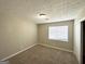 Cozy bedroom features neutral carpeting and a large window at 4992 Needle Knob Ct, Lithonia, GA 30038