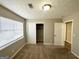 Cozy bedroom featuring neutral carpeting, a closet, and ample natural light at 4992 Needle Knob Ct, Lithonia, GA 30038