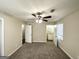The main bedroom includes a ceiling fan and doors to an ensuite bathroom at 4992 Needle Knob Ct, Lithonia, GA 30038
