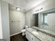Well-lit bathroom featuring granite countertops, tub, and modern fixtures at 210 Huntington Dr, Mcdonough, GA 30253