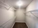 Walk-in closet with ample shelving at 210 Huntington Dr, Mcdonough, GA 30253