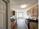 Open kitchen features granite countertops and a view to the breakfast and living areas at 210 Huntington Dr, Mcdonough, GA 30253
