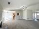 Open-concept living area with fireplace, ceiling fan, and views into the dining and kitchen areas at 210 Huntington Dr, Mcdonough, GA 30253