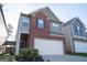Charming two-story home with a brick facade and an attached two-car garage at 1735 Labonte Pkwy, Mcdonough, GA 30253