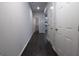 A long hallway with dark wood floors and white walls at 1735 Labonte Pkwy, Mcdonough, GA 30253