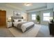 Spacious main bedroom with tray ceilings and large windows at 1735 Labonte Pkwy, Mcdonough, GA 30253